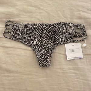 Acacia snake skin size large bottoms never been worn